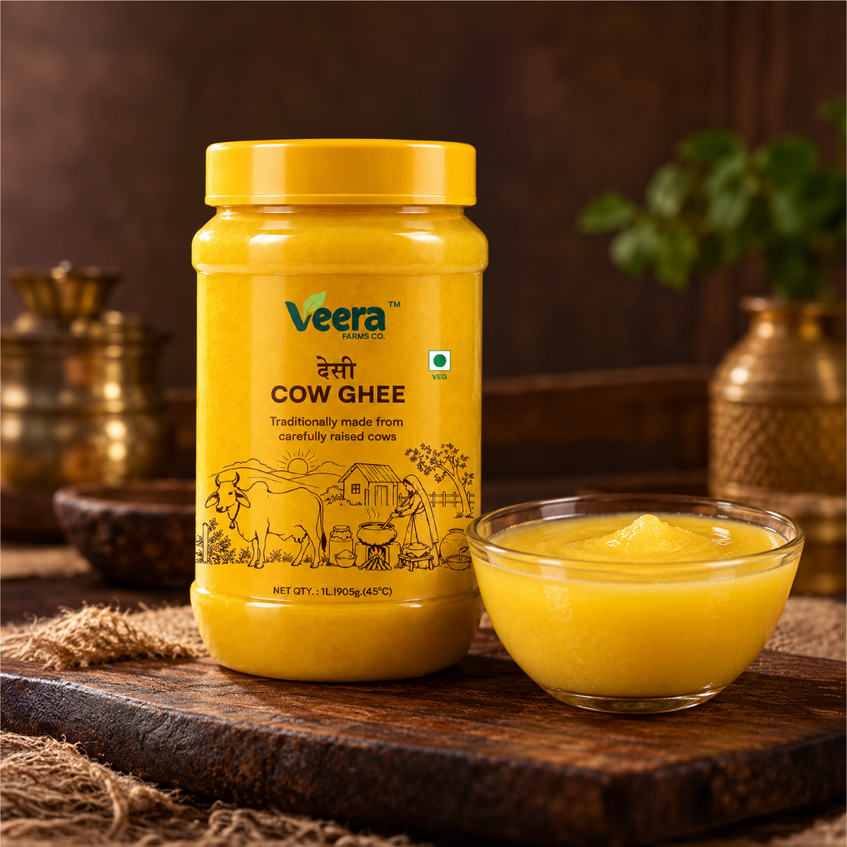 A jar of Veera Brand Cow Ghee next to a small glass bowl filled with yellow ghee, set on a dark wooden surface with rustic props in the background.