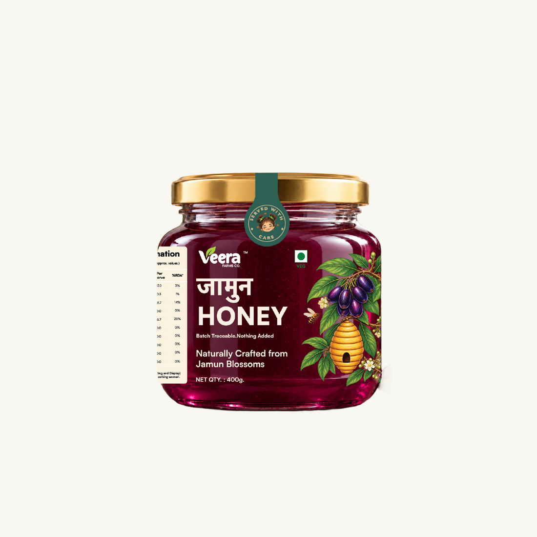 A glass jar of Veera Jamun Honey with a gold lid and a dark green seal, featuring a label with Hindi text 'JAMUN HONEY' and illustrations of jamun berries and a beehive, set against a solid off-white background.